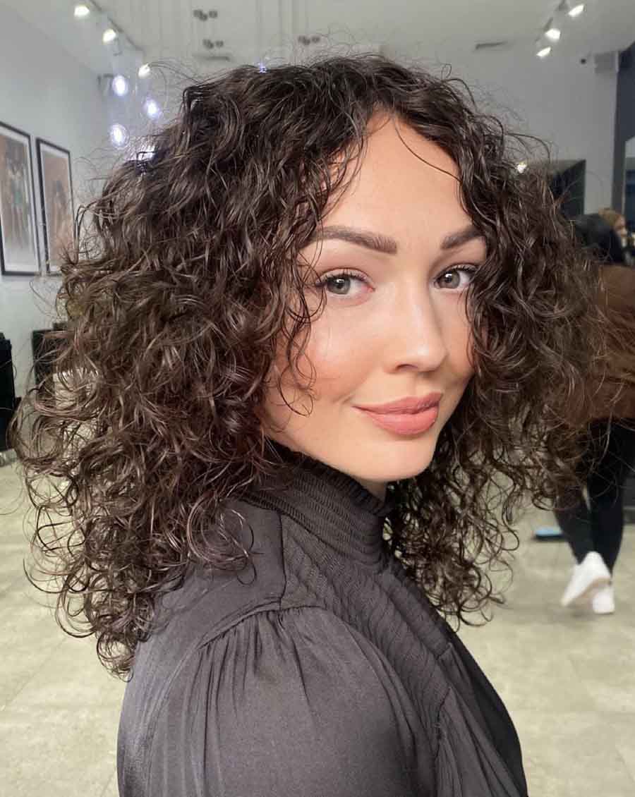 Breezy Curly Cut shoulder length hairstyle for women