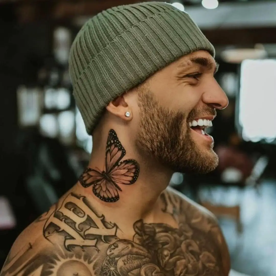 Black and Gray Butterfly Tattoo on Man’s Neck