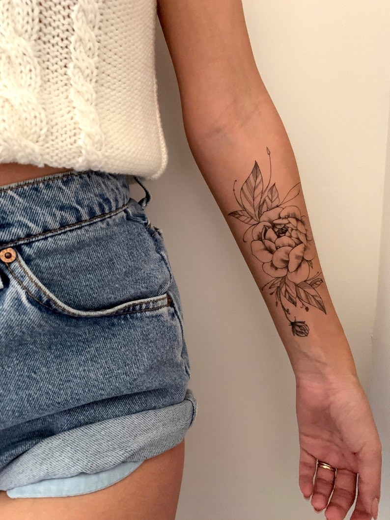 rose forearm tattoo
