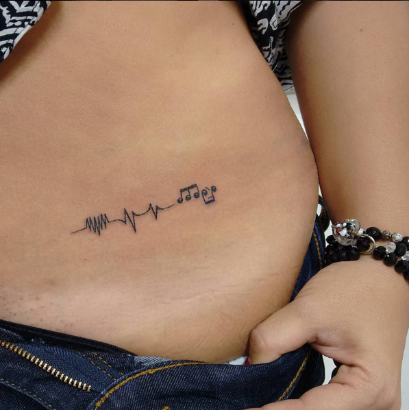 stomach tattoos for females 8
