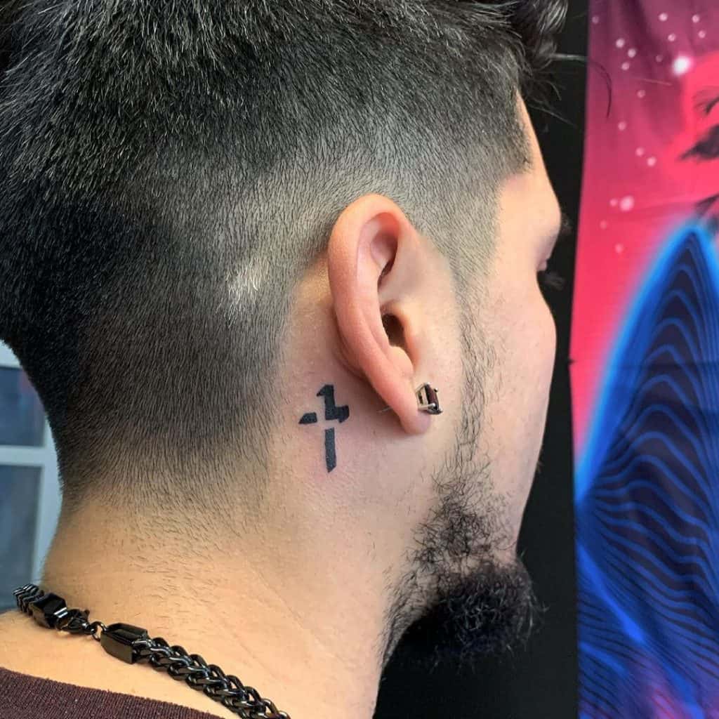 cross behind ear small tattoo for men