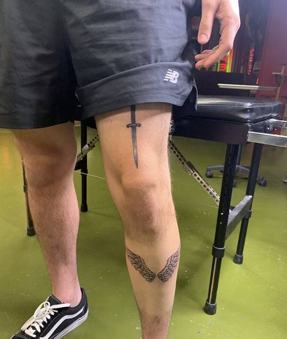 sword thigh tattoo for men
