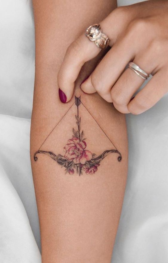 arrow tattoo with flower