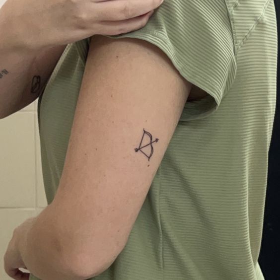 small bow and arrow tattoo