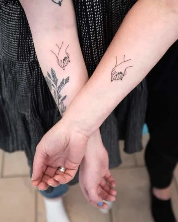 Cute-holding-hands-Mother Daughter Tattoos