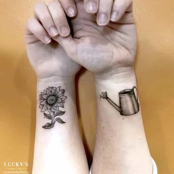 Sunflower-and-watering-can Mother Daughter Tattoos