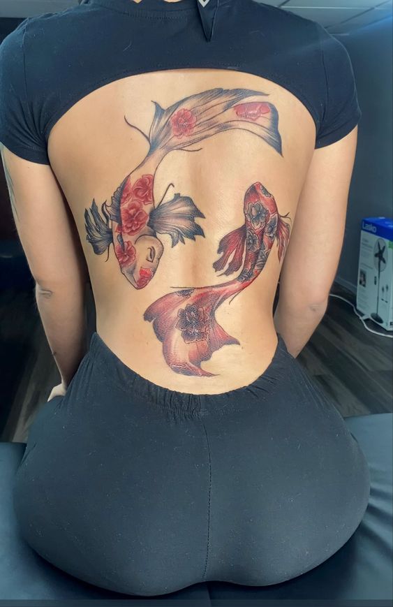 red and black koi fish tattoo