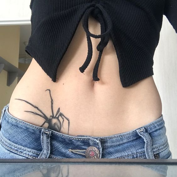 spider tattoo on belly for women