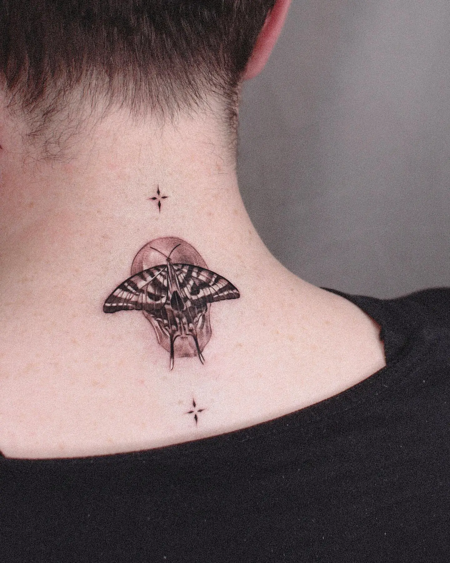Butterfly Skull Tattoo on Neck
