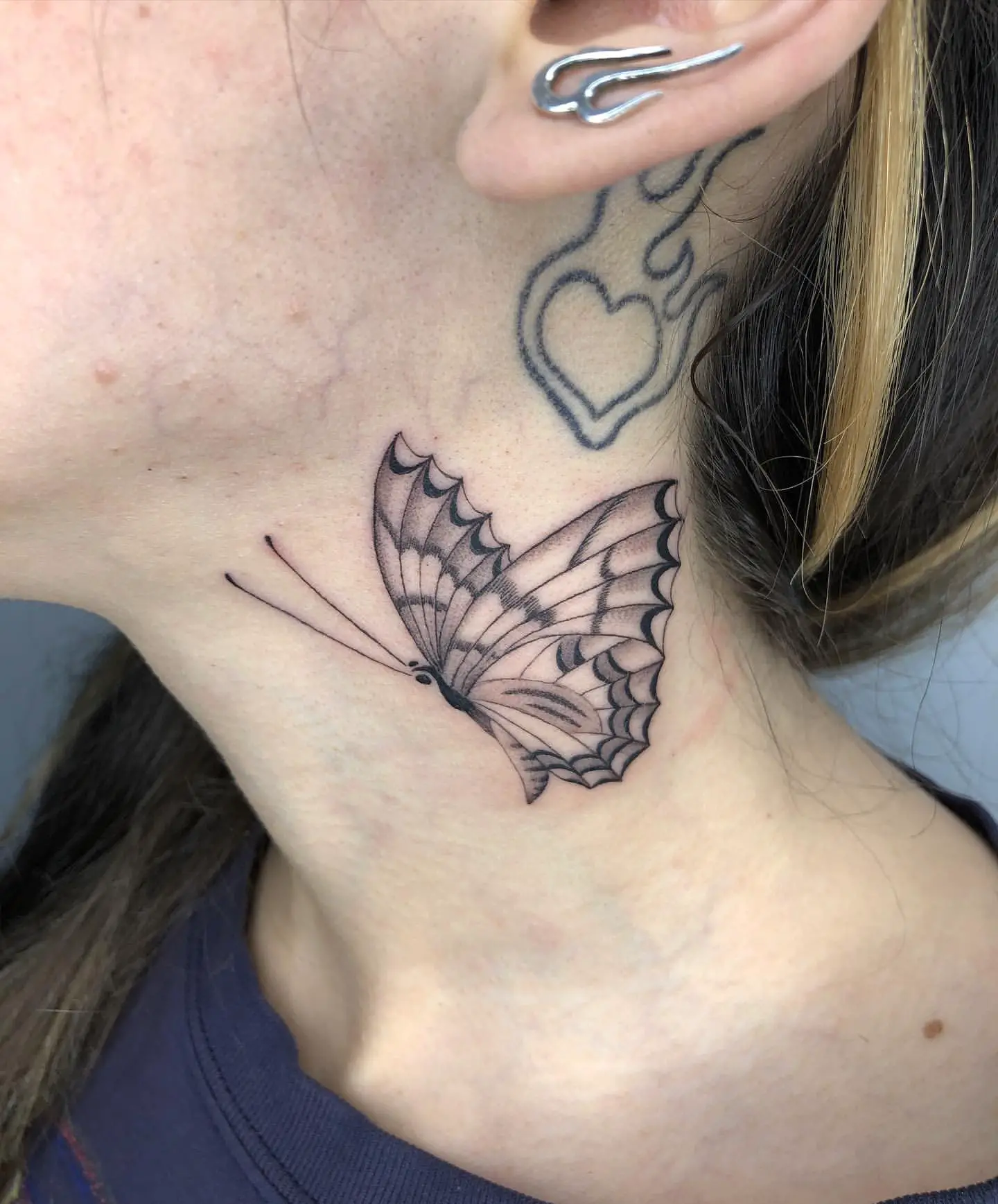 Combined Linework and Blackwork Butterfly Tattoo
