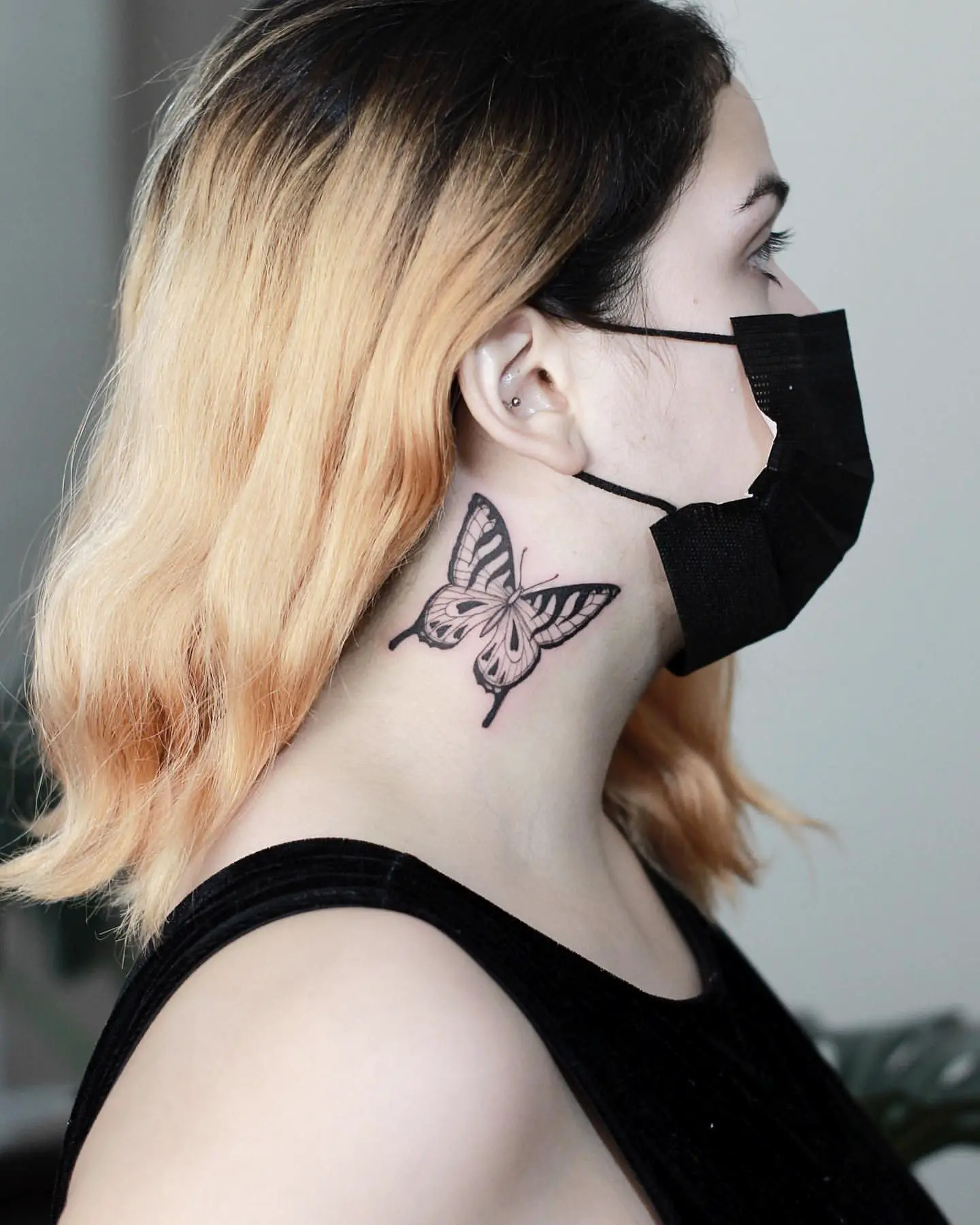 Fineline Blackwork Butterfly Tattoo on Woman’s Neck