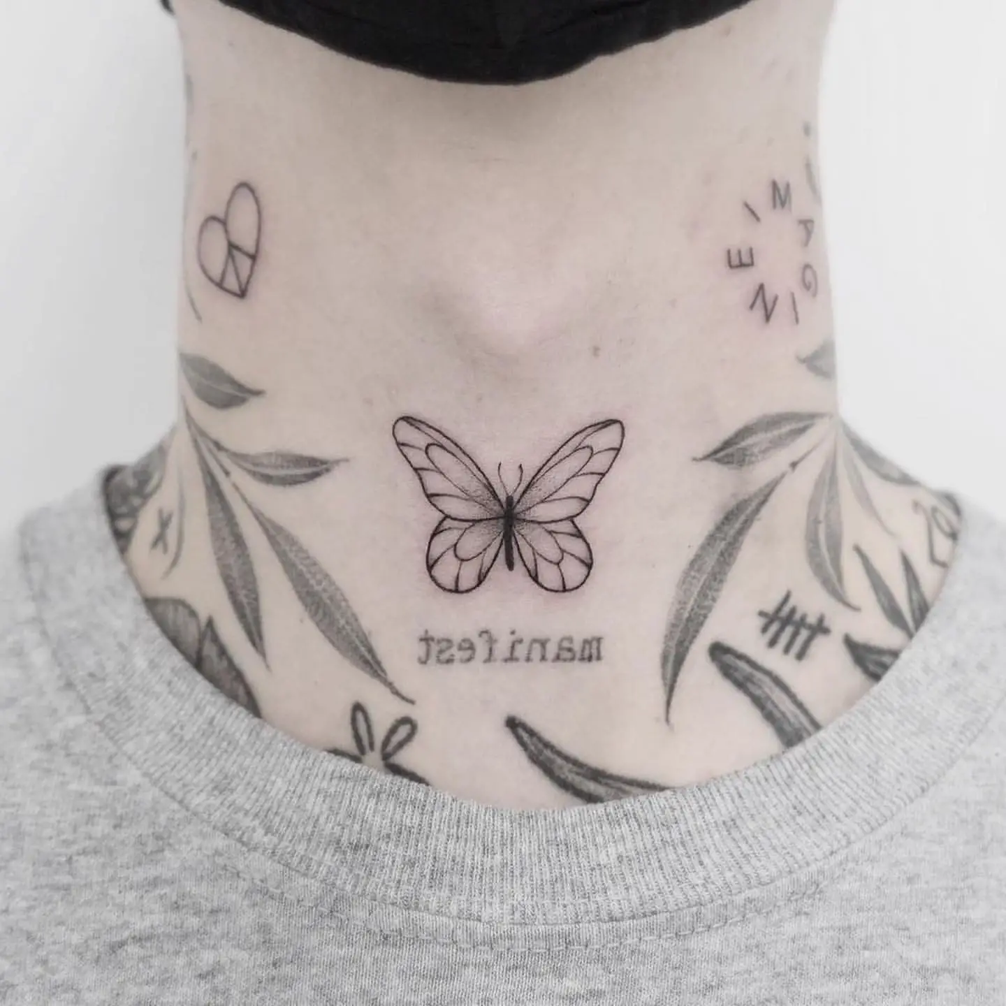 Linework Butterfly Tattoo on Man’s Neck