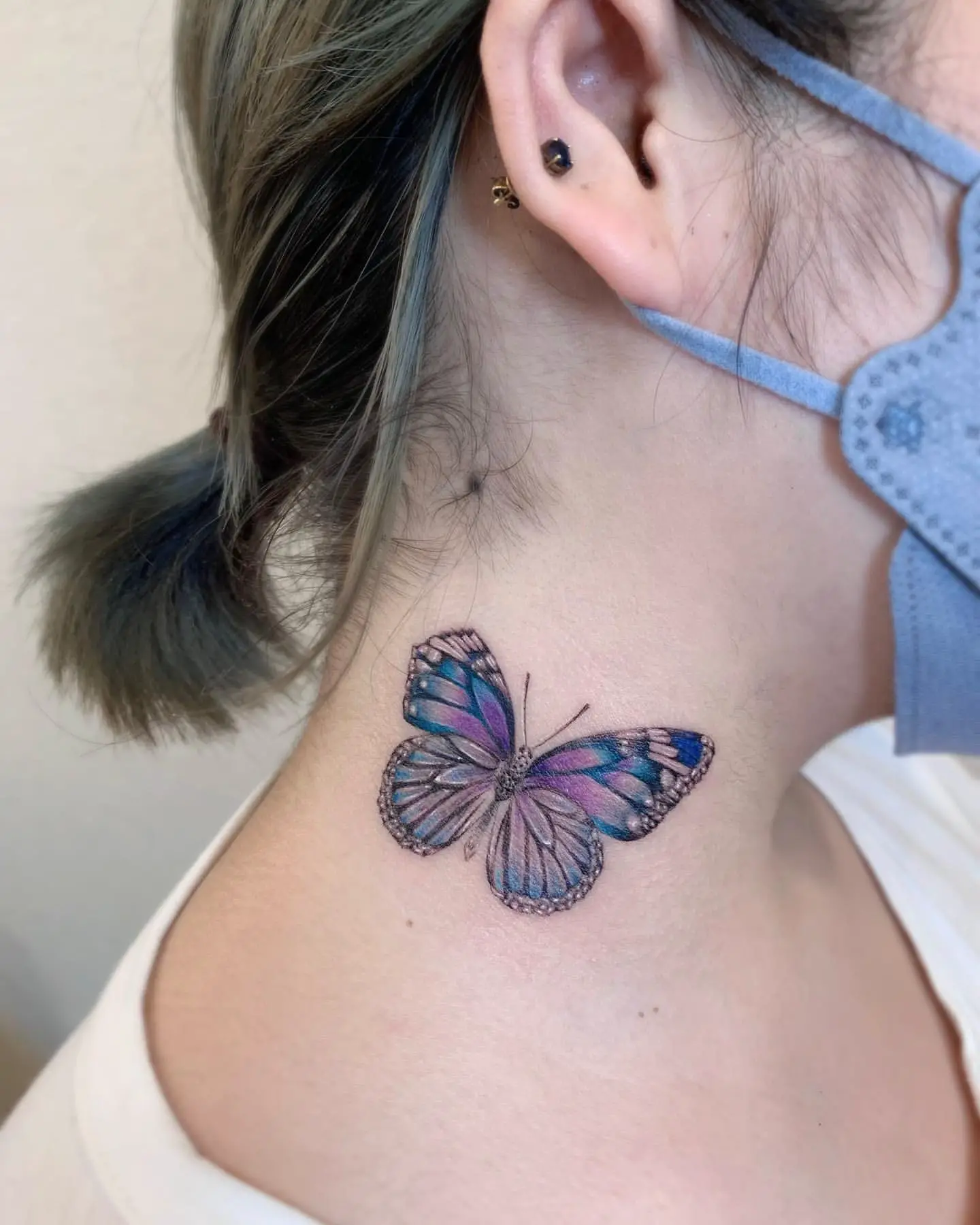 Realistic Watercolor Butterfly Tattoo on Woman’s Neck
