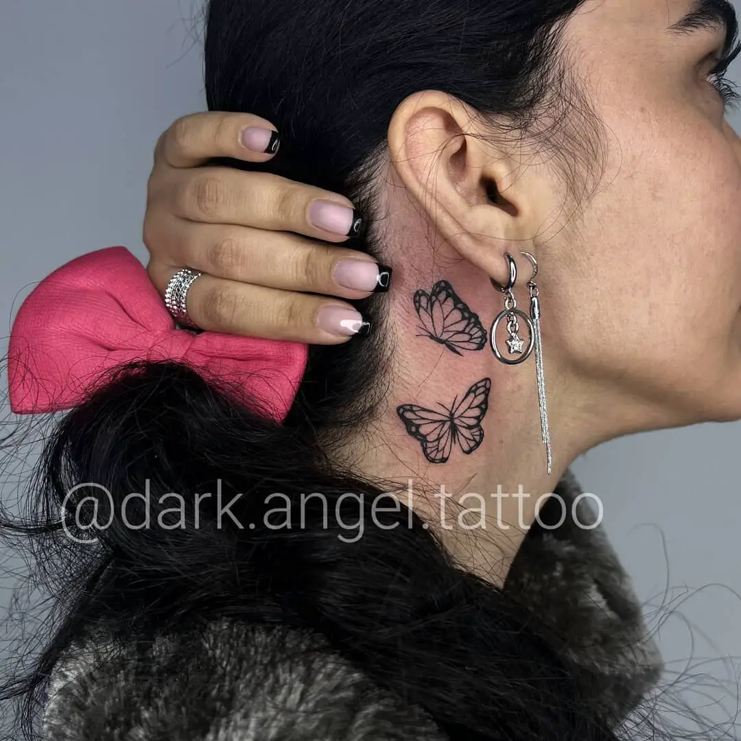Two Minimal Butterfly Tattoos on Woman’s Neck